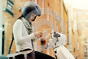 Motorcycle, woman and phone with navigation search in a city with helmet on a street. Motorbike, mobile connectivity and