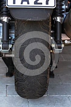 A motorcycle with worn tires