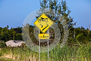 Motorcycles slip warning sign in canada