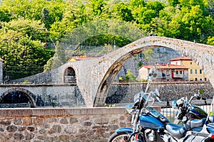 Motorcycling at the Devil`s Bridge, Garfagnana, Lucca photo