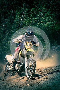 Motorcyclist on dirt track