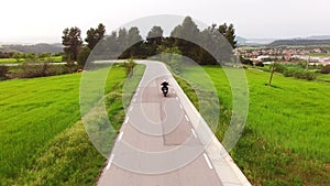 Motorcyclist Driving his Enduro Motorbike on a Curvy Road