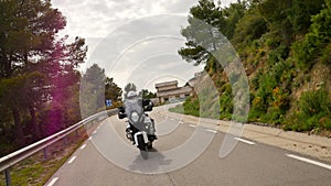 Motorcyclist Driving his Sports Motorbike on a Curvy Road