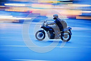 Motorcyclist in motion photo