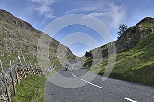 Motorcyclist on mountain road