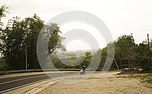 Motorcyclist passing through the winding road