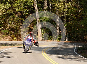 Motorcyclist on a winding road