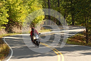 Motorcyclist on a winding road