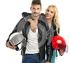 Motorcyclists couple with helmets