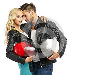Motorcyclists couple with helmets