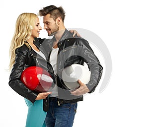 Motorcyclists couple with helmets