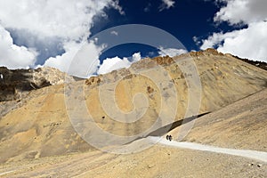 Motorcyclists on the mountain road in the Himalaya, Tibet region in Jammu and Kashmir