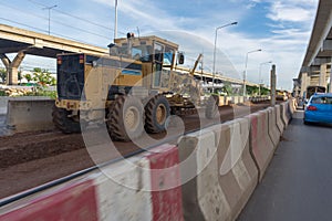Motorgrader working at Construction site of sky train redline Ba