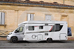 Motorhome camper van parked in traditional street houses in Bordeaux France