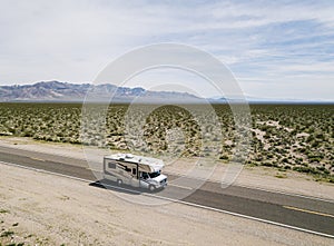 motorhome driving on a highway in the desert of USA California