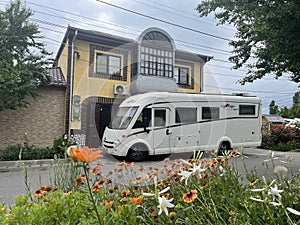 Motorhome in front of a house