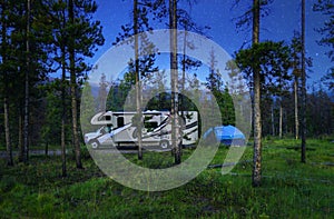 Motorhome RV Camper Camping Under The Stars In Nature Forest photo