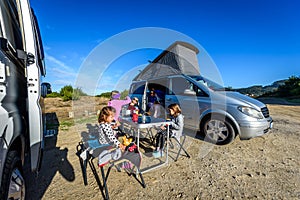 Motorhome RV or campervan is parked on a beach