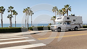 Motorhome trailer or caravan for road trip. Ocean beach, California USA. Camper van, RV motor home.