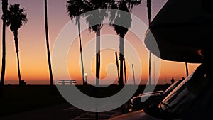 Motorhome trailer, caravan for road trip, palm trees, California beach at sunset