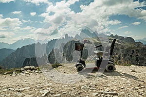 Motorised wheelchair for disposable people, Mobile electric buggies on the mountain, Dolomites, Italy.