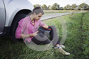 Motorist with empty petrol can