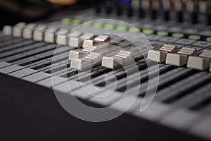 Motorized fader on a studio mixing desk photo