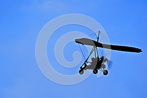 Motorized Hang Glider in Flight - Side On photo