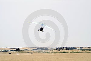 Motorized hang glider in Sahara