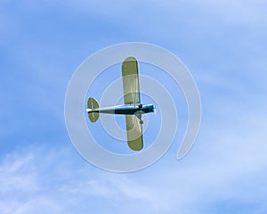 Motorsport airplane on the blue sky