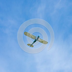 Motorsport airplane on the blue sky