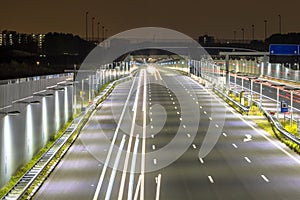 Motorway with entrance of tunnel at night