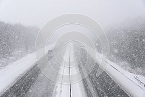 Motorway during heavy Snowfall photo