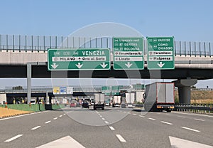 motorway junction with directions to the Italian cities and road junctions with trucks and cars