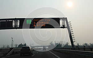 motorway sign indicating that there is a lot of fog in the Italian towns of Northern Italy and you must drive carefully