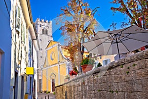 Motovun. Old cobbled street and church in historic town of Motovun