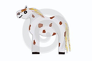 Mottled horse caricature cut out of paper isolated on white background