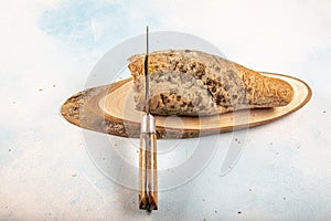 Mouldy moldy bread. Mould growing old bread on wooden table. Wastage of bread and stale bread