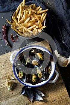 Moules-frites, typical Belgian mussels and fries photo
