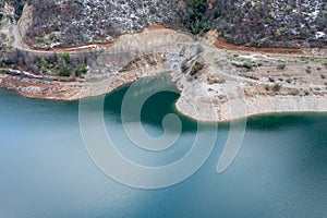 Mounains Lagoon Ancoa in the snow en region Maule, Chile. Aerial drone view