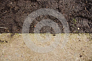 Mound construction. Soil background. Park ground texture with rocks mulch and dirt. Black soil texture. fine texture of brown gra