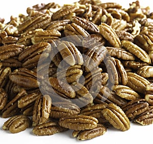 Mound of pecan nuts on a white background