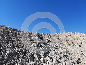 mounding landscape with blue sky