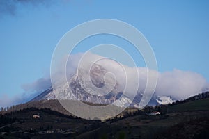 Mount Acuto in winter with clouds on the Summit, Apennines, Umbria, Italy