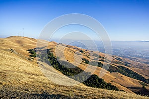 Mount Allison and the golden hills surrounding it on a sunny day; downtown San Jose in the background, south San Francisco bay,