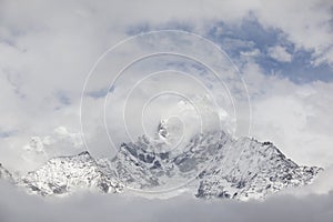 Mount Ama Dablam in Clouds. Himalaya Mountain Range.