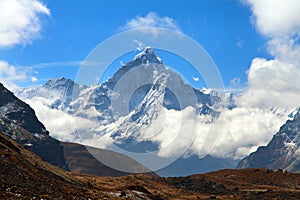 Mount Ama Dablam within clouds, way to Everest base camp