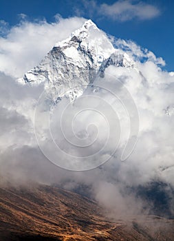 Mount Ama Dablam within clouds, way to Everest base camp