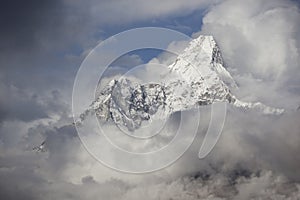 Mount Ama Dablam in The Stormy Clouds. Himalaya Mountain Range.