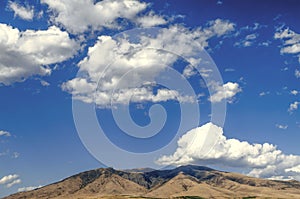 Mount Ara ler in sunny day against the blue sky covered by clouds photo